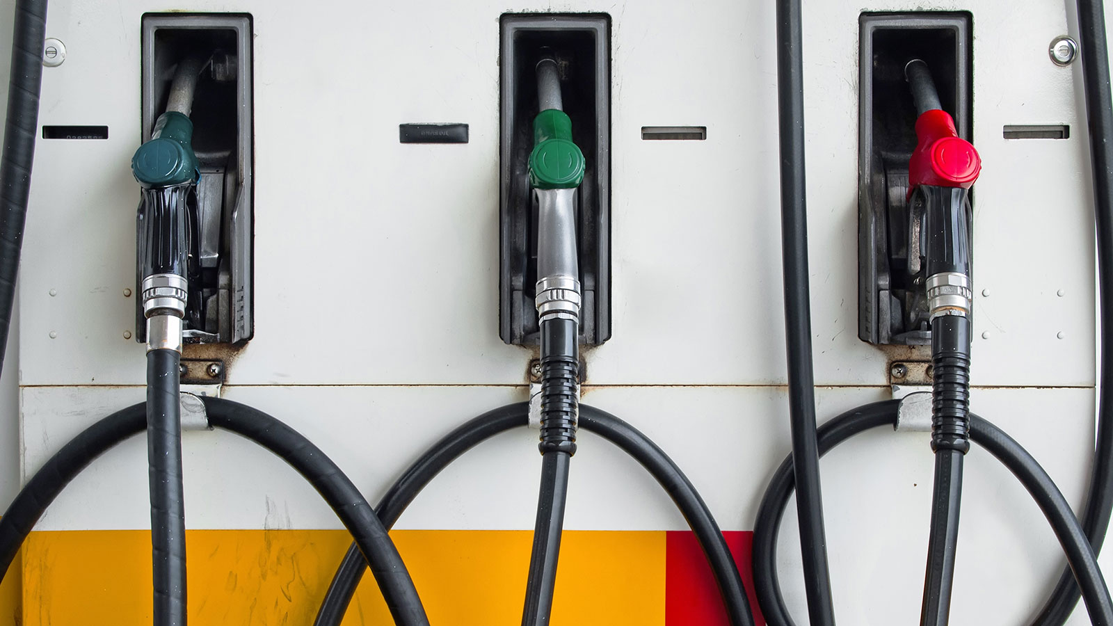 Front of Three Gas Pump Nozzles at Gas Station Ready to work