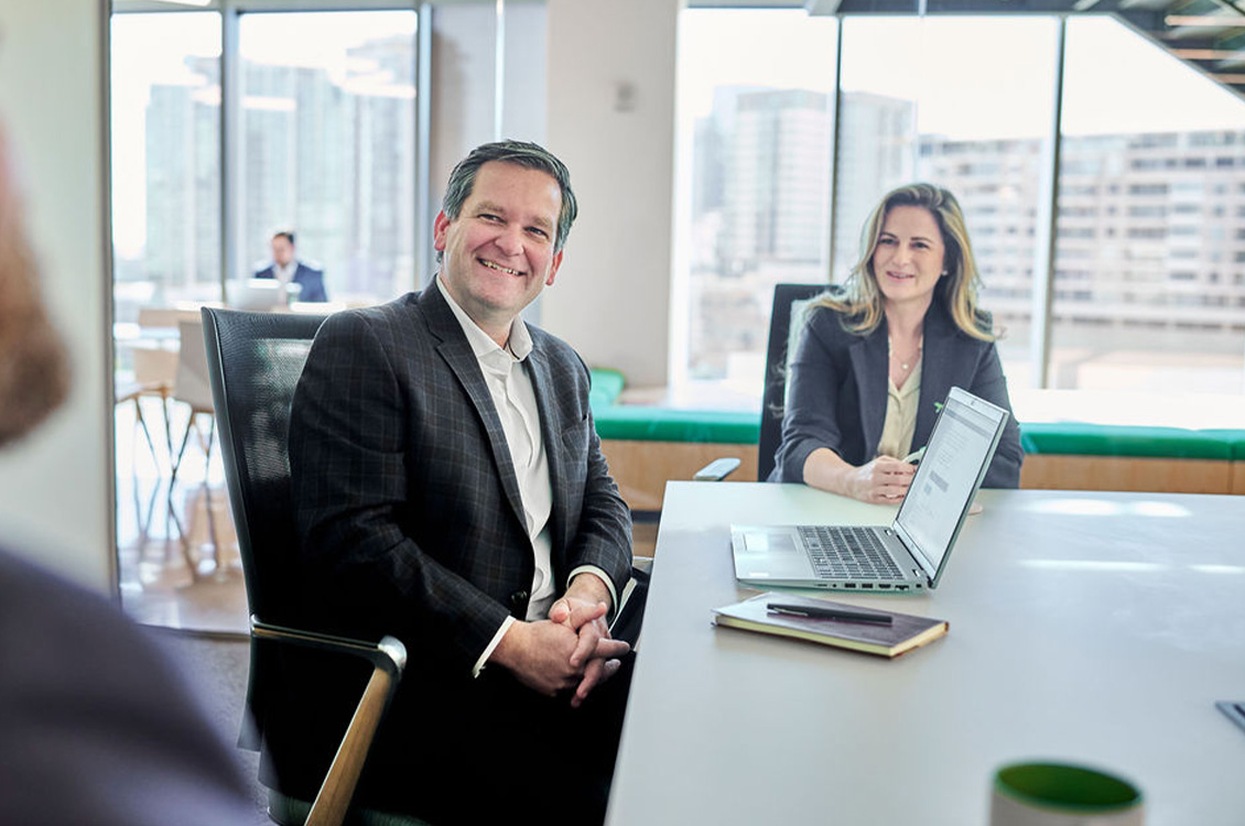 Group of Weaver employees gathered and discussing