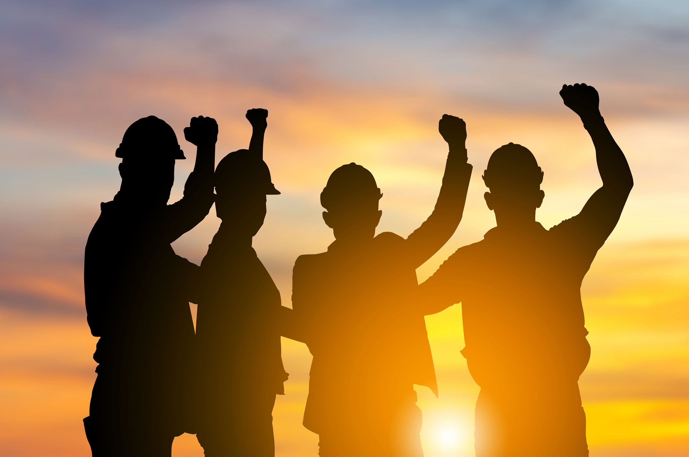 Silhouette of engineer and worker team with clipping path joining hands and celebration