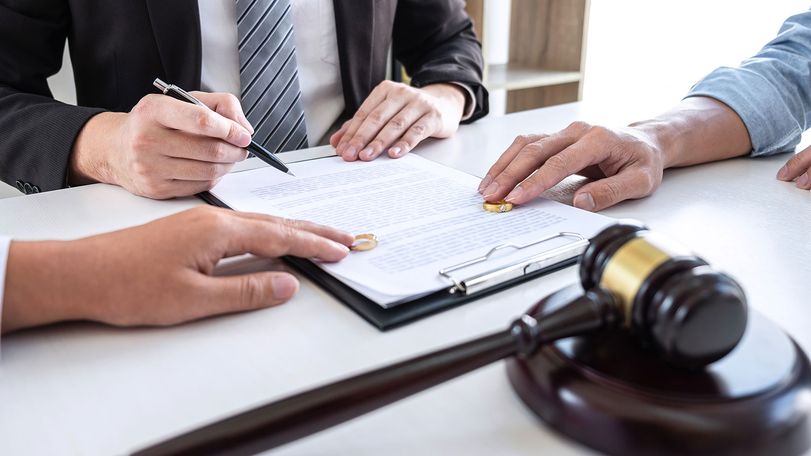 Young couple telling their problems in the courthouse to getting divorced or premarital agreement in lawyers office