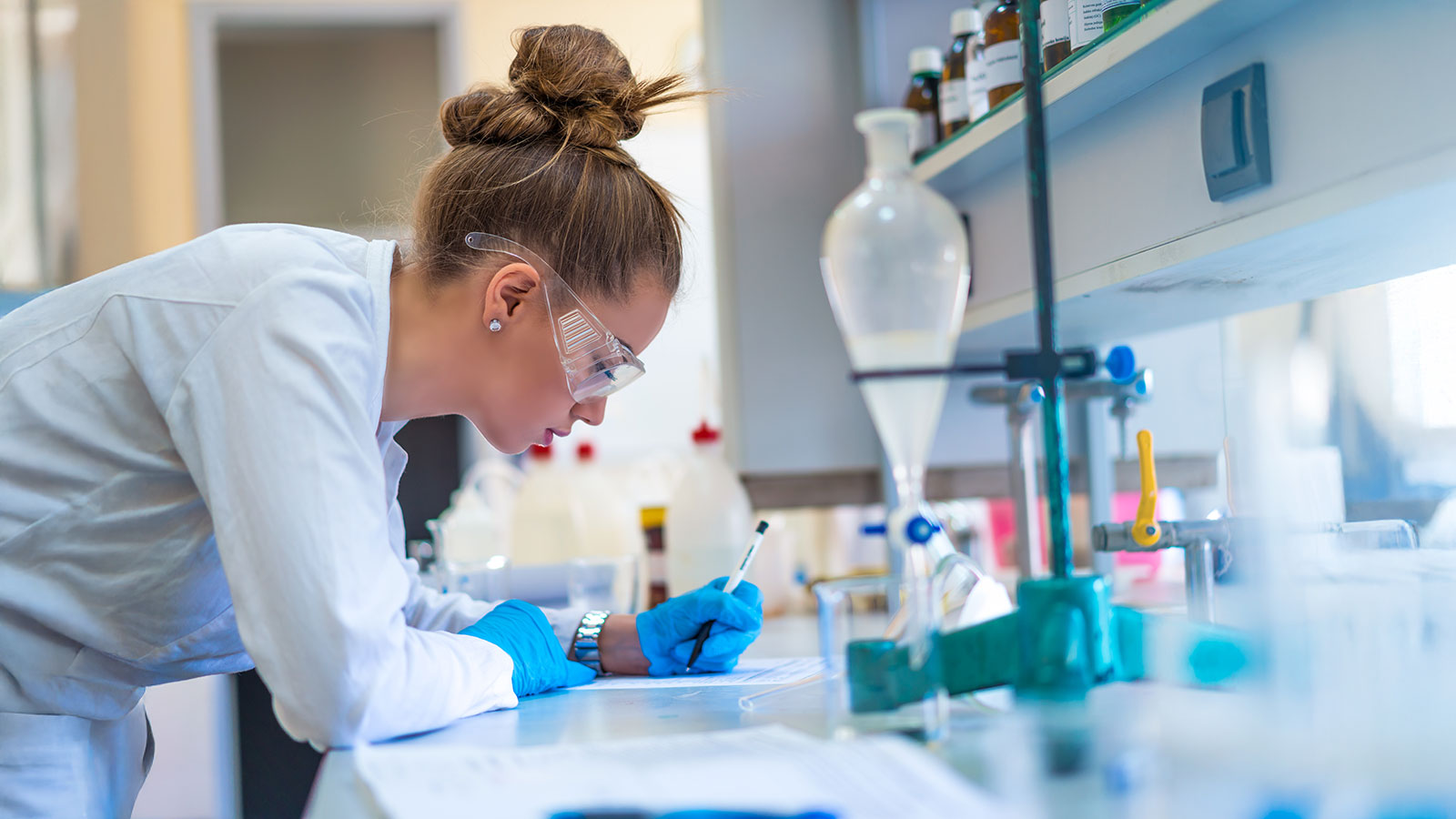 Young woman scientist in laboratory working