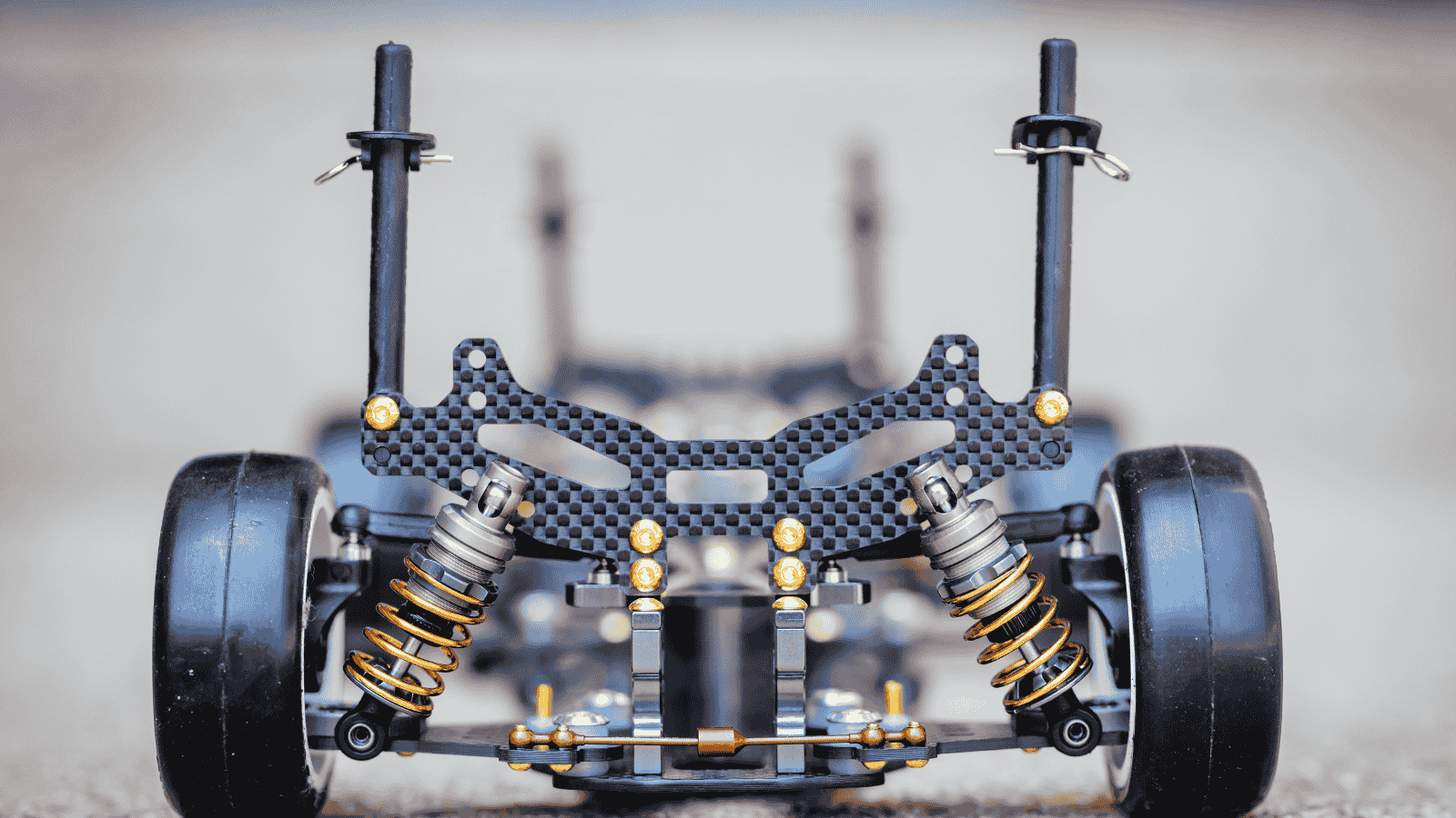 RC car chassis and parts being built to form a radio controlled race car